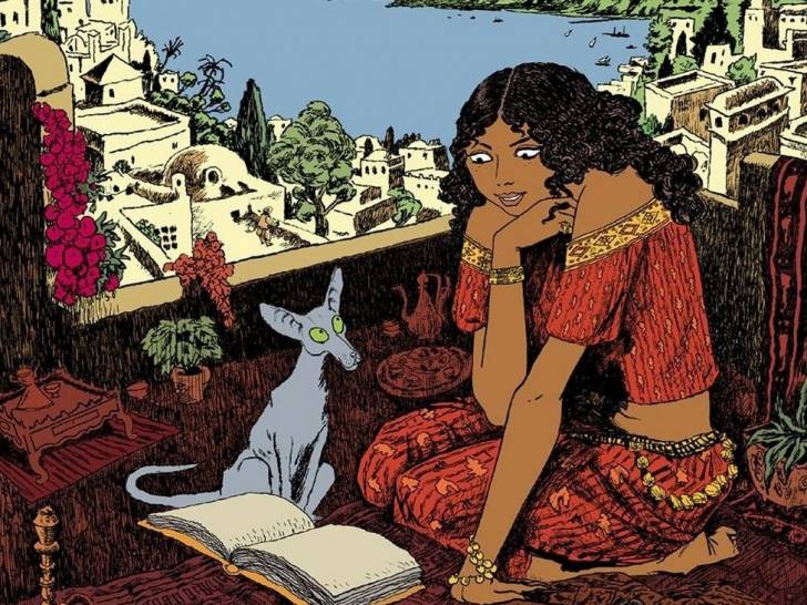 Un chat avec une jeune femme observant un livre dans « Le Chat du rabbin »
