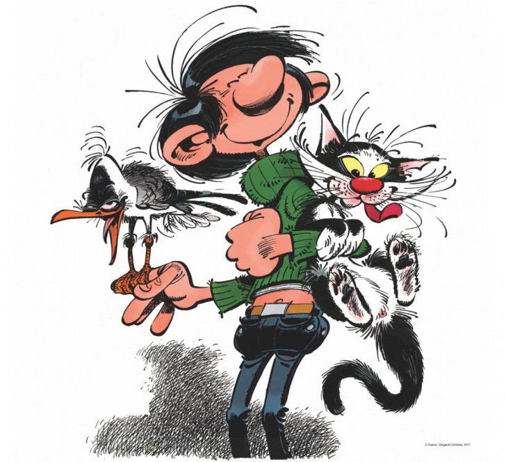 Gaston Lagaffe tenant son chat et son oiseau