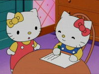 Hello Kitty debout à côté de Daniel Starr, qui est assis à une table