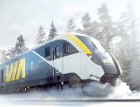Un train Via Rail Canada en marche dans un paysage enneigé
